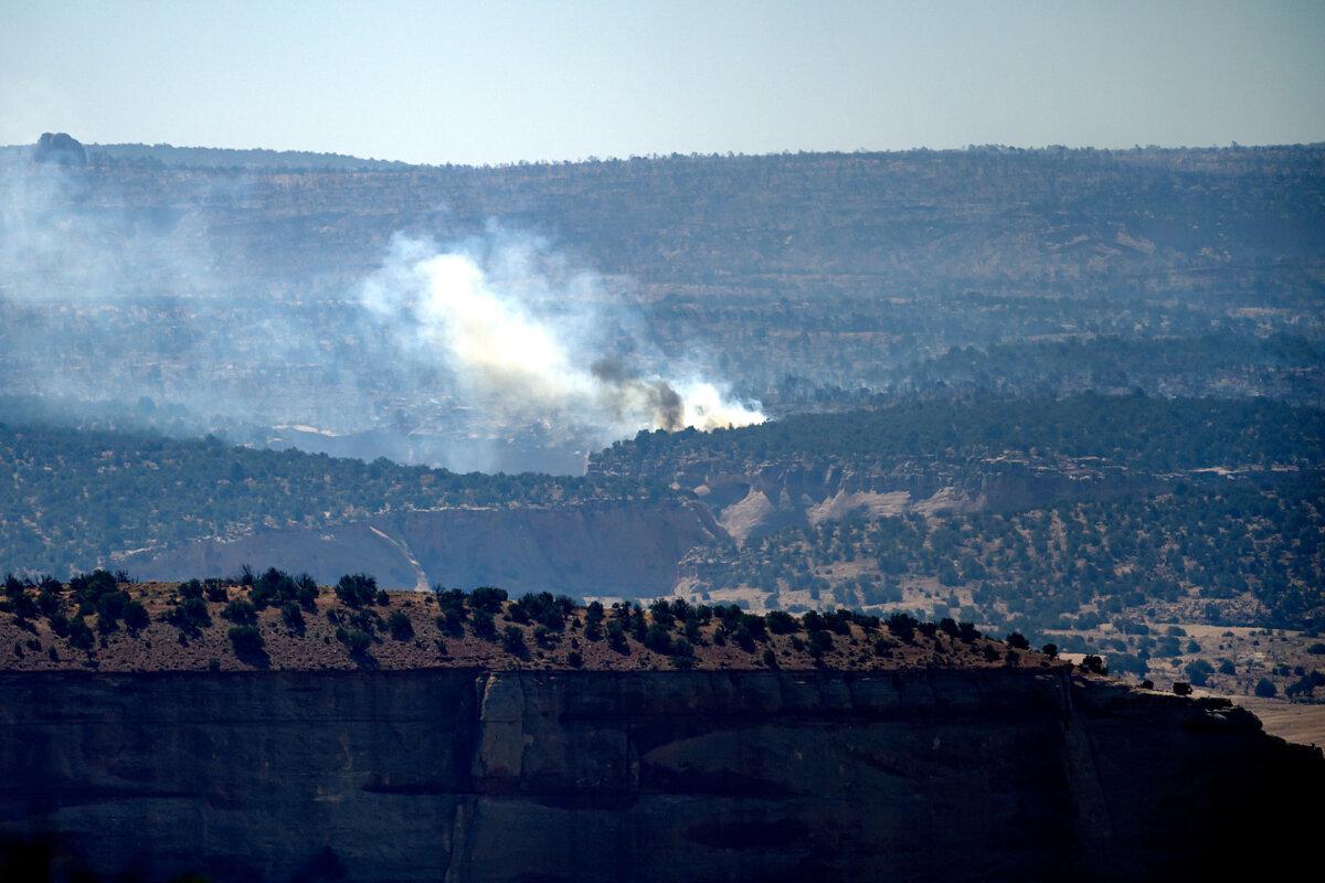 Smoke rises from the Snyder Fire burning near Thompson Springs, Utah, on June 28, 2026. (AP Photo/Noah Berger)