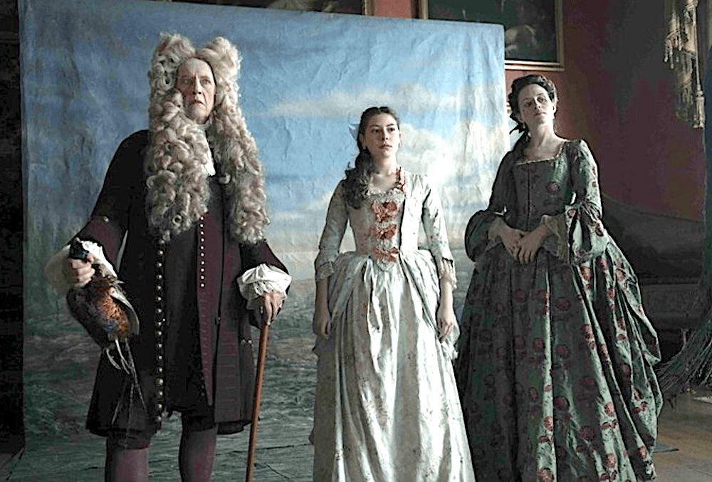 (L–R) Sir Chauncey Savage (Richard E. Grant ), Fanny Savage (Kíla Lord Cassidy), and Lady Savage (Claire Foy) in "Savage House." (Dean Rogers/Paramount Picture)