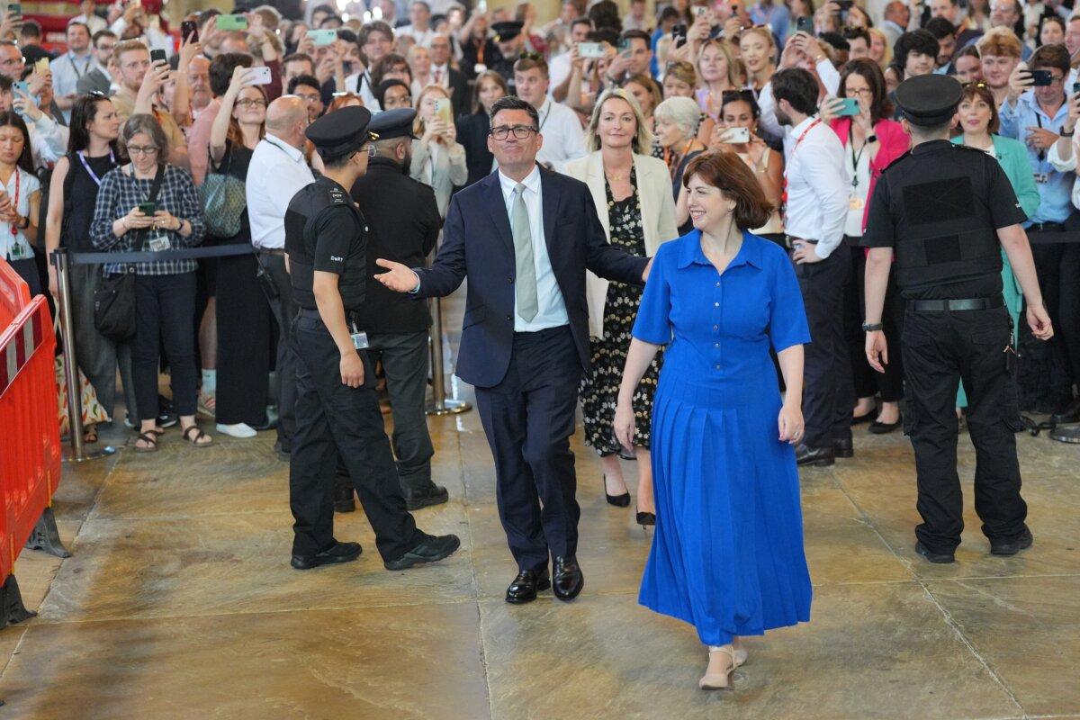 Andy Burnham with colleagues from the Parliamentary Labour Party in Westminster Hall at the Houses of Parliament in central London, as he returns to the House of Commons to take up his seat after winning the Makerfield by-election, on June 22, 2026. (Yui Mok/PA via AP)