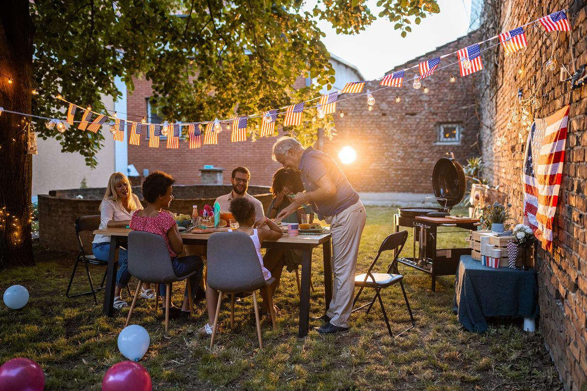 Successful hosts focus less on elaborate decorations and more on creating opportunities for conversation and connection. (miodrag ignjatovic/Getty Images)