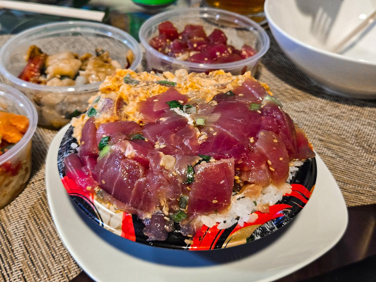 Poke has deep roots in Hawaiian cuisine, traditionally featuring diced raw fish seasoned with ingredients like soy sauce, seaweed, sesame oil, and green onions. (Kevin Revolinski)