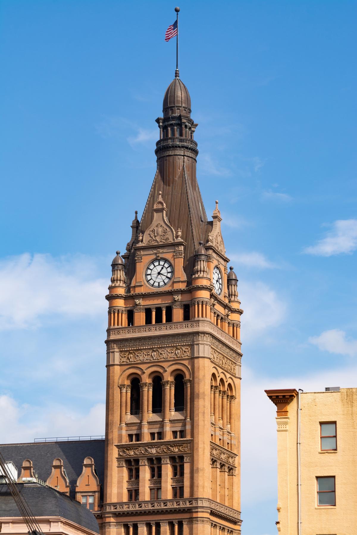 Flemish buildings are often defined by a large bell tower. Architect Henry Koch made certain Milwaukee City Hall sported a tall tower that includes not only a bell but a not-to-miss clock too. In true German spirit, the four-sided clock is even bordered by turrets resembling beer steins. Inside is a heavy 22,5000-pound bourdon bell that chimes. Atop the tower is a copper-clad spire. (Eddie J. Rodriquez/Shutterstock)