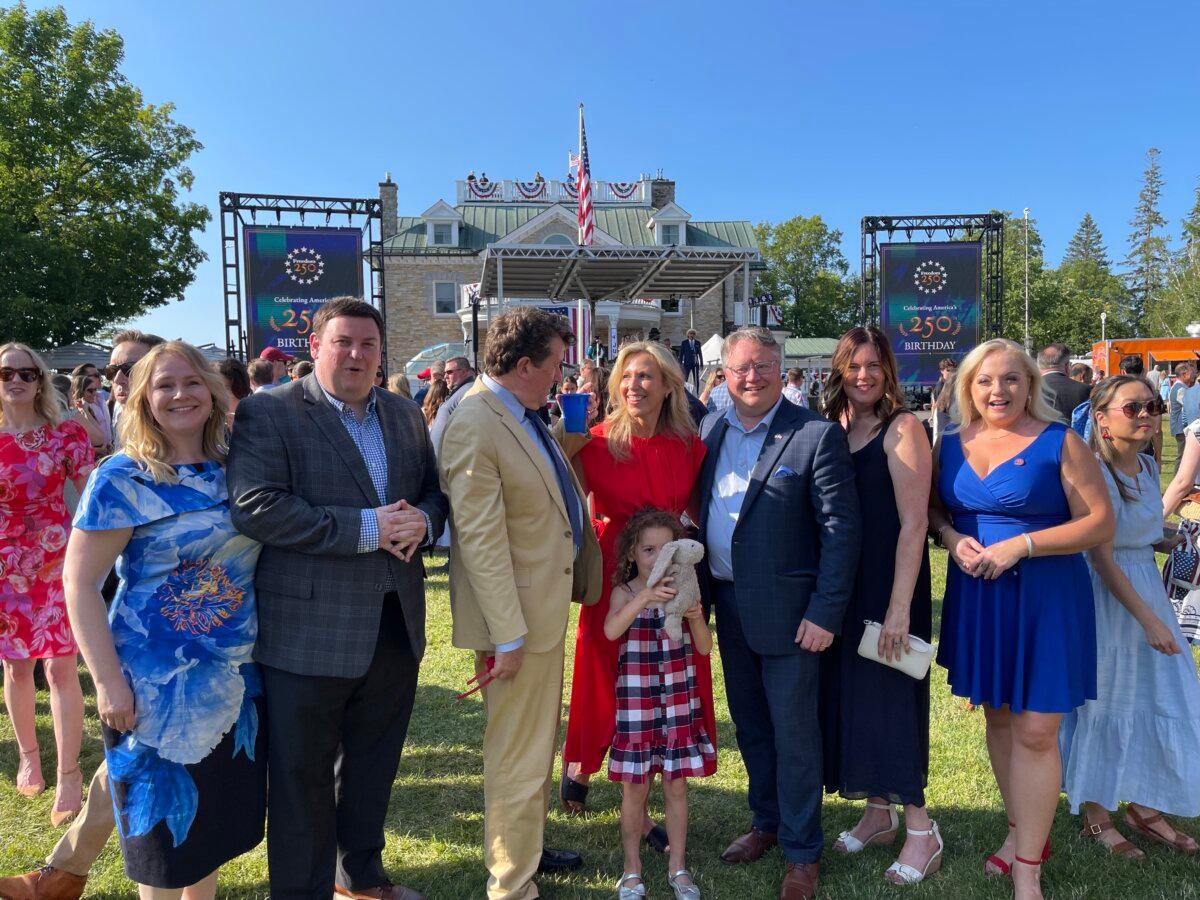 Conservative MPs and their companions (L–R) Andrew Lawton, John Williamson, Shelby Kramp-Neuman, Richard Bragdon, and Lianne Rood pose for a photo at the U.S. ambassador's residence on July 4, 2026. (Noé Chartier/The Epoch Times)