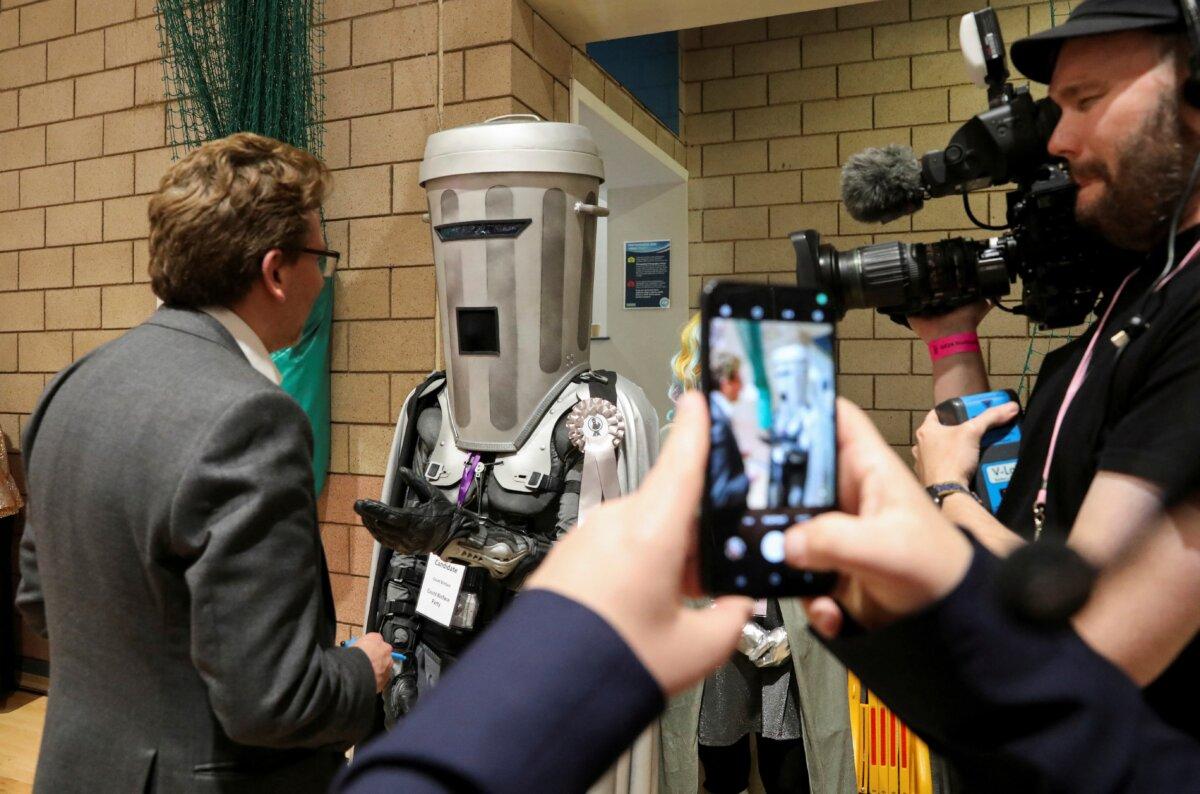 Independent candidate Count Binface speaks to a journalist as he arrives for the vote count in Britain's general election at the Richmond and Northallerton count center in Northallerton, England, on July 5, 2024. (Temilade Adelaja/Pool via AP, file)