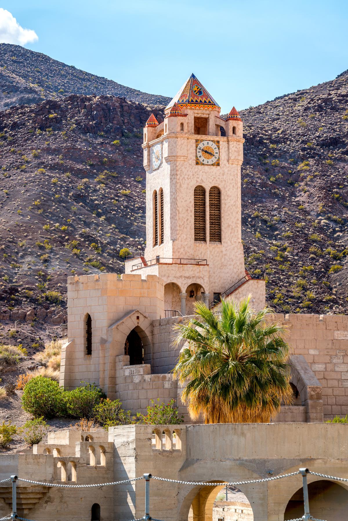 One of the most notable features at Scotty’s Castle is the five-story, four-sided clock tower with 25 chimes. Four smaller octagonal steeple-roof corner bartizans, which are the overhanging, enclosed smaller turrets, mirror the tower’s central octagonal steeple roof. The six-inch clock faces are crafted of hand-painted glazed tiles. (4nadia/Getty Images)