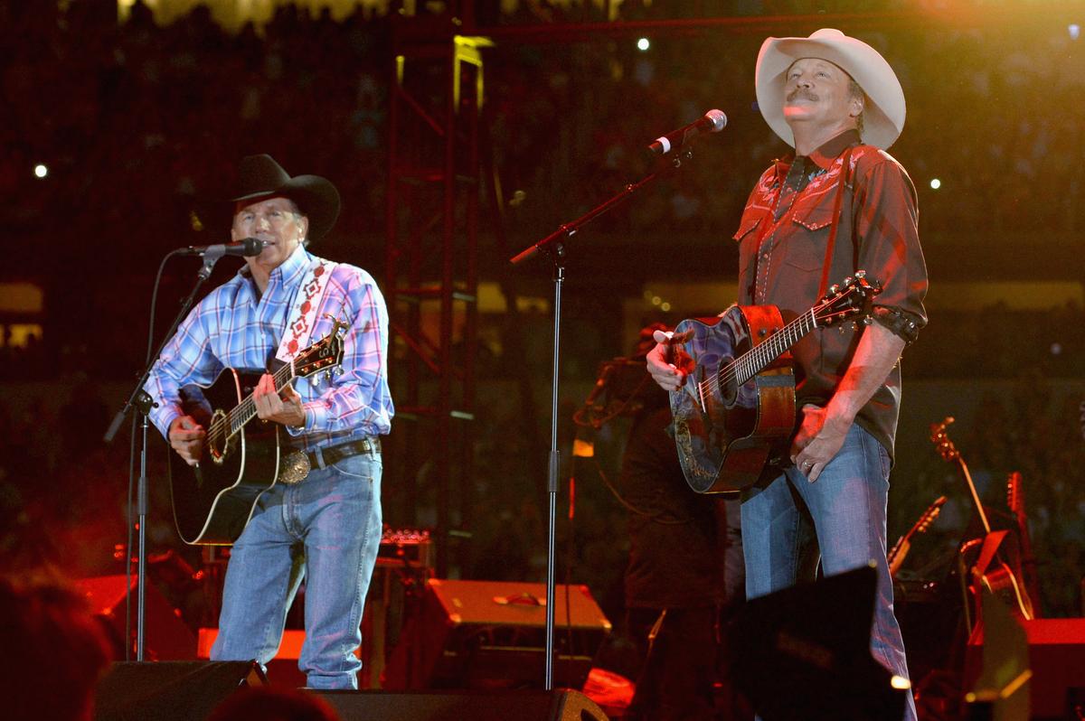 Musicians George Strait (Left) and Alan Jackson perform "Amarillo by Morning" and "Murder on Music Row" during George Strait's 2014 "The Cowboy Rides Away Tour" at AT&T Stadium in Arlington, Texas. (Rick Diamond/Getty Images)
