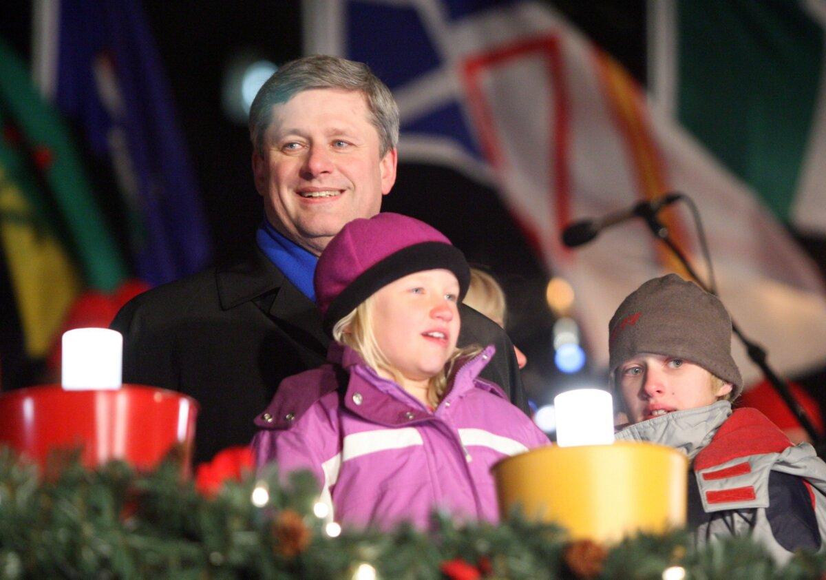 Prime Minister Stephen Harper, son Ben, and daughter Rachel take part in the lighting of the Christmas lights on Parliament Hill on Dec. 7, 2006. (CP Photo/Jonathan Hayward)