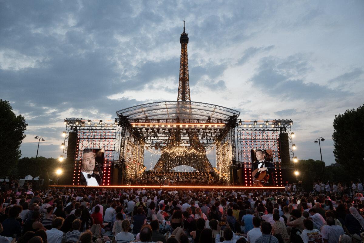 Crowds gather on the Champ-de-Mars to enjoy the 14th Concert de Paris before the fireworks on the eve of France's National Day on July 13, 2026. (David Nivière/Courtesy of France Télévisions)