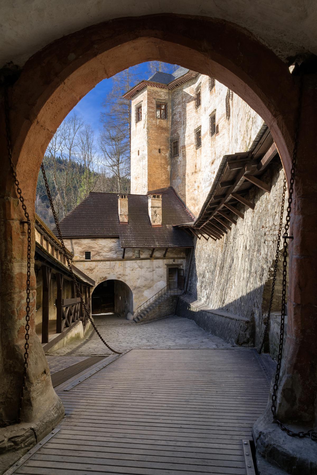 Spanning a defensive ditch before the gatehouse, the drawbridge once guarded the lower castle's sole entrance and exit. Built under John of Dubovec, a nobleman who held the castle and led its 16th-century fortification campaign to counter the rise of artillery, the bridge could be raised to block attackers. Today, a permanent bridge stands in its place, yet the passage still hints at the fortress's formidable defenses. (Jaroslav Moravcik/Shutterstock)