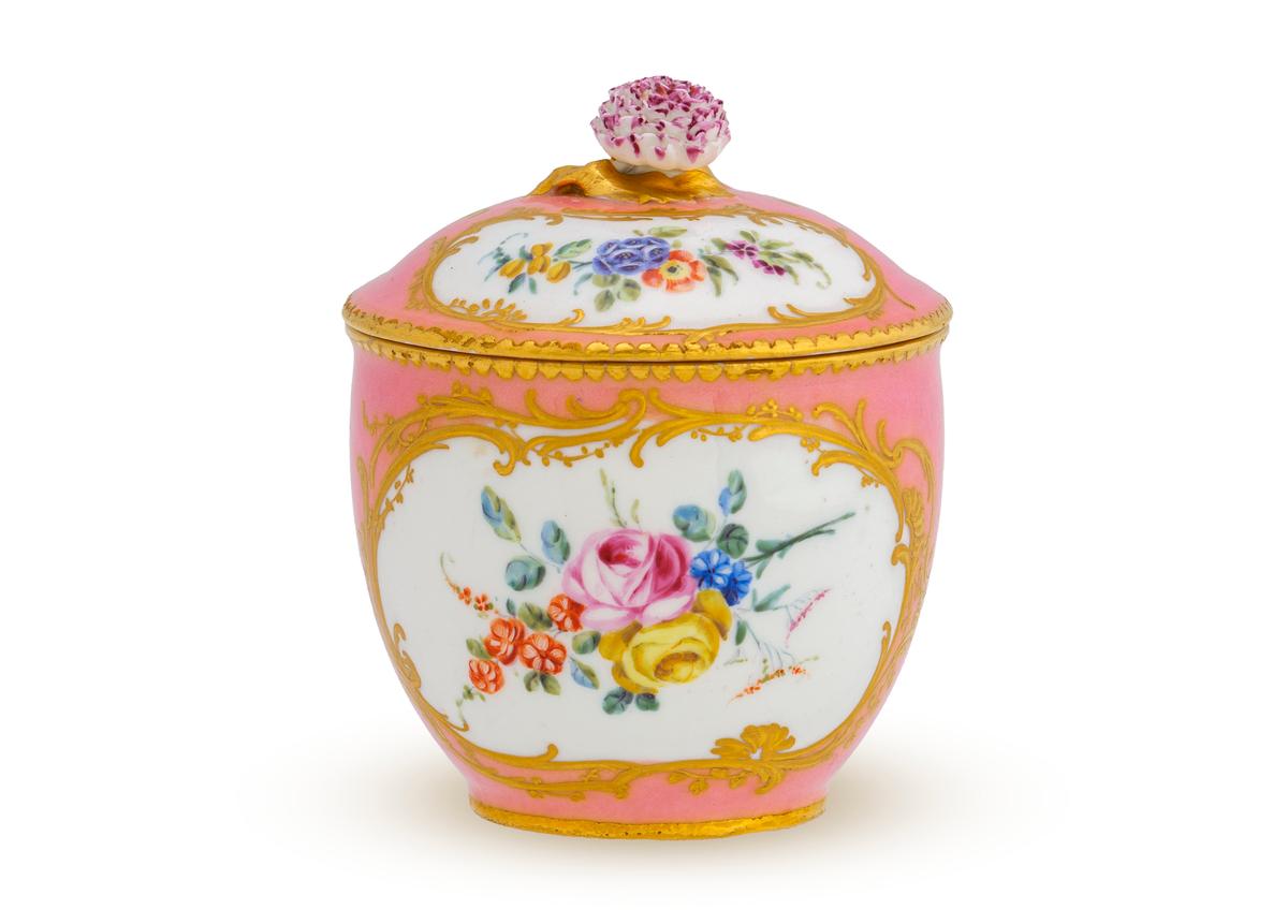 “Sugar Bowl from a Madame de Pompadour Service,” 1758, by Vincent Taillandier of Sèvres Porcelain Manufactory. Porcelain with enamel and gilt; 3 3/4 inches by 3 inches. The sugar bowl features the distinctive pink glaze known as Rose Pompadour. New Orleans Museum of Art. (Courtesy of NOMA)