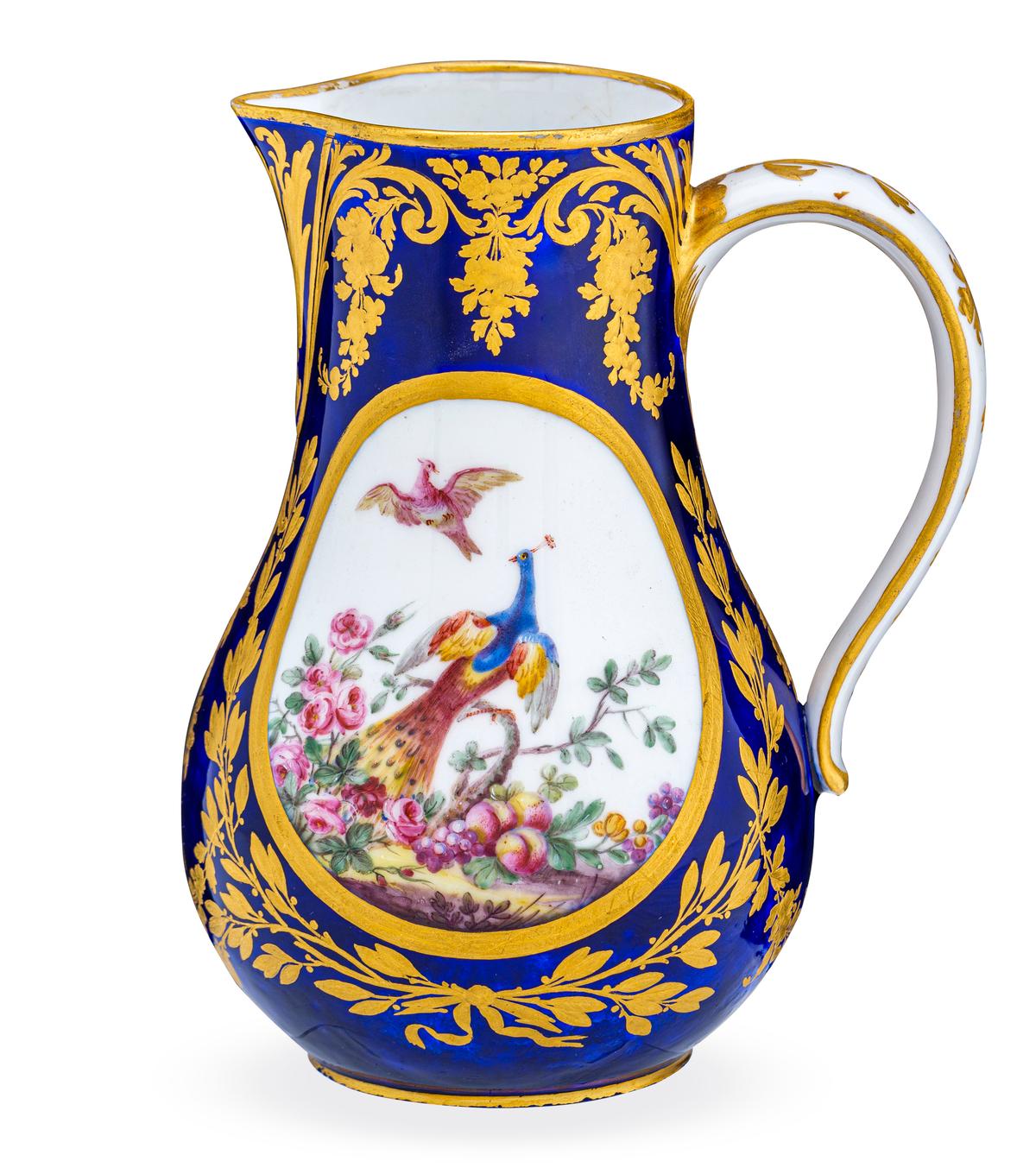 "Water Jug," 1780, painted by Denis Levé and gilded by Etienne-Henry Le Guay of Sèvres Porcelain Manufactory. Porcelain with enamel and gilt: 6 7/8 inches 5 1/2 inches. New Orleans Museum of Art. The jug features colorful birds adapted from George Edwards's “A Natural History of Uncommon Birds.” (Courtesy of NOMA)