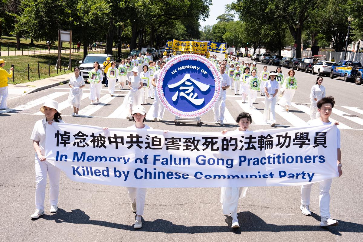 Falun Dafa practitioners take part in a march calling for the end of the Chinese Communist Party’s 27 years of persecution of Falun Gong in China, in Washington on July 23, 2026. (Larry Dye/The Epoch Times)