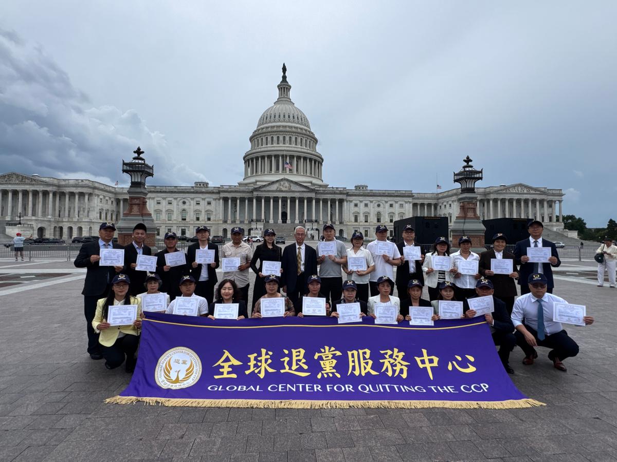 People who renounced affiliations with the CCP and its affiliated organizations take a group photo with Zhiyuan Wang, president of the Global Service Center for Quitting the CCP, outside the U.S. Capitol on July 21, 2026. (Courtesy of the Global Service Center for Quitting the CCP)