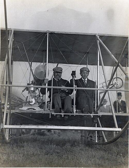 Arch Hoxsey and President Theodore Roosevelt in a Wright Flyer before their famous 1910 flight. (Public Domain)