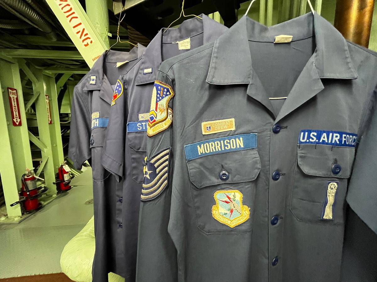 Old uniforms hang inside the launch control facility at the Titan Missile Museum in Green Valley, Ariz., on July 24, 2026. (Allan Stein/The Epoch Times)