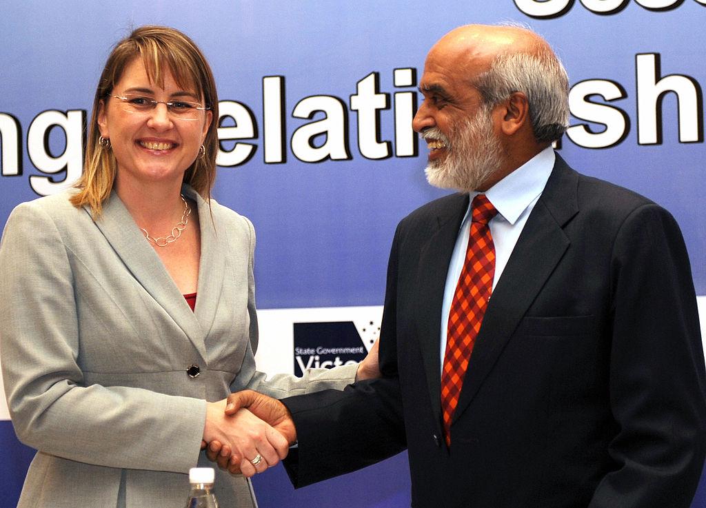 Then-state Skills and Workforce Minister Jacinta Allan (L) shakes hands with the National Institute for Information technology (NIIT) Director P. Rajendran in New Delhi on Sept. 25, 2009. (Raveendran/AFP via Getty Images)