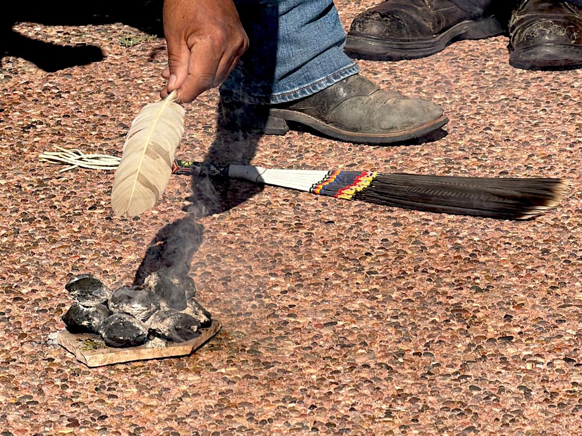 The blessing in Window Rock, Ariz., incorporated traditional Navajo sacred objects, including a feather and burning charcoals. (Allan Stein/The Epoch Times)