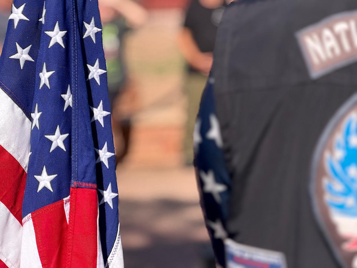 A single flag will travel 14,000 miles through 50 states as part of the Nation of Patriots tour to honor veterans, seen here in Window Rock, Ariz., on July 28, 2026. (Allan Stein/The Epoch Times)