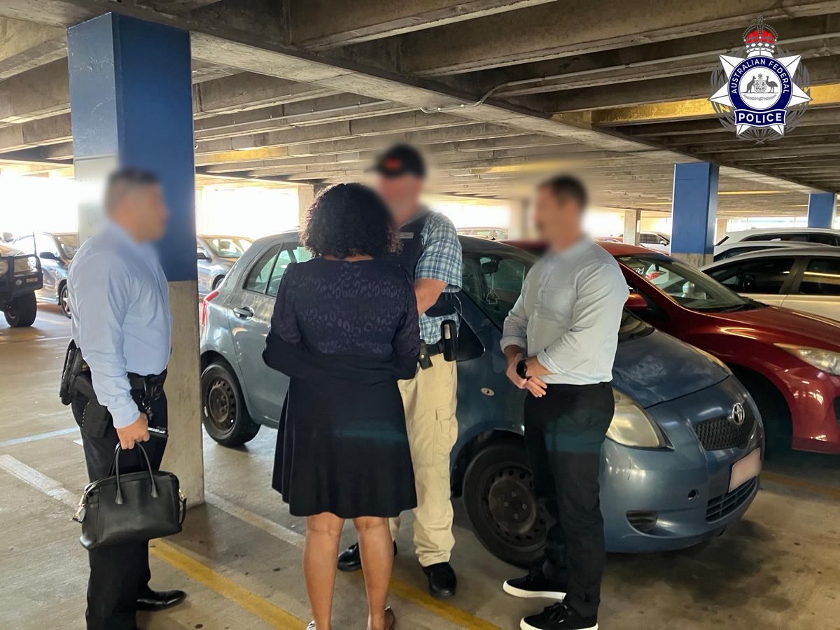 Police arrest the 39-year-old Darwin woman, jointly accused of fraudulently obtaining as much as $18 million from the National Disability Insurance Scheme (NDIS). (Courtesy of the Australian Federal Police)
