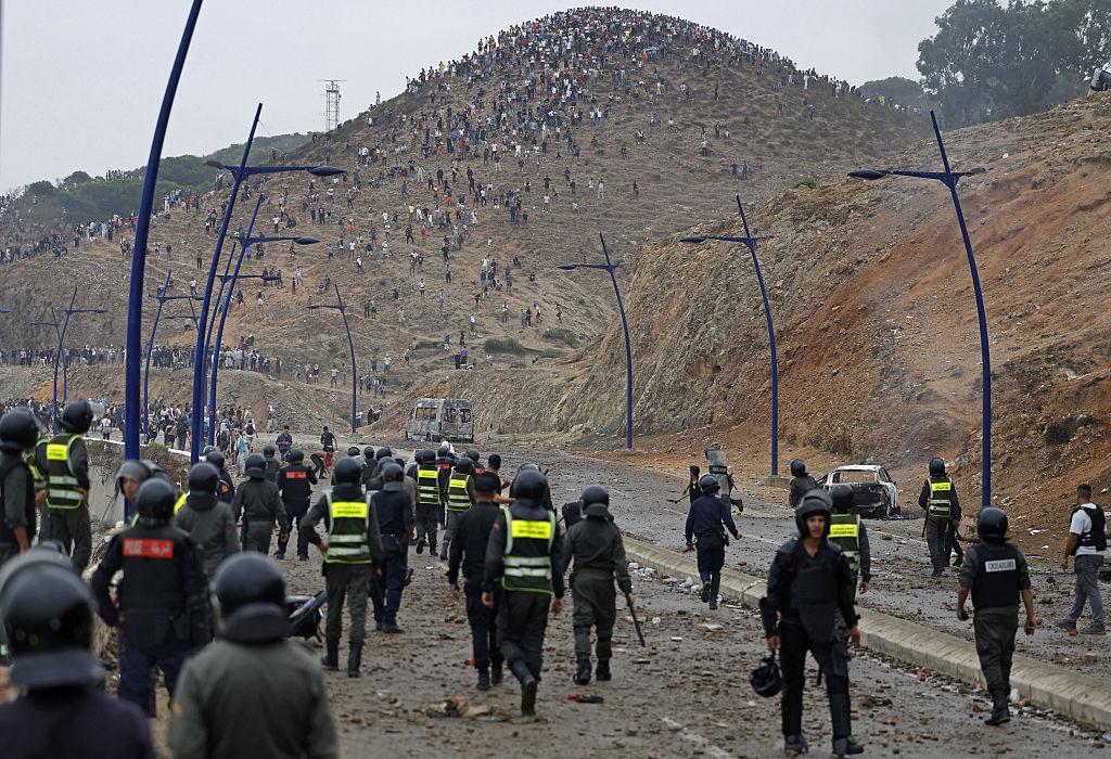 Members of Moroccan security forces gather at the site of clashes near Fnideq, on the Morocco–Spain border, on July 31, 2026. (Abdel Majid Bziouat/AFP via Getty Images)