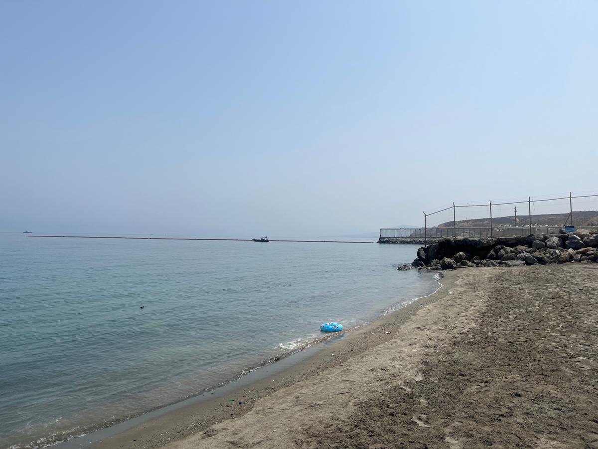The newly installed 500-meter floating barrier off Tarajal beach at the Ceuta–Morocco maritime border on Aug. 1, 2026. (Etienne Fauchaire/The Epoch Times)
