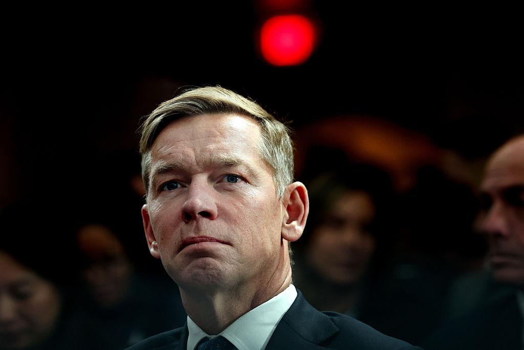 McDonald's CEO Chris Kempczinski listens as U.S. President Donald Trump delivers remarks at the McDonald’s Impact Summit at the Westin DC Downtown in Washington on Nov. 17, 2025. (Win McNamee/Getty Images)