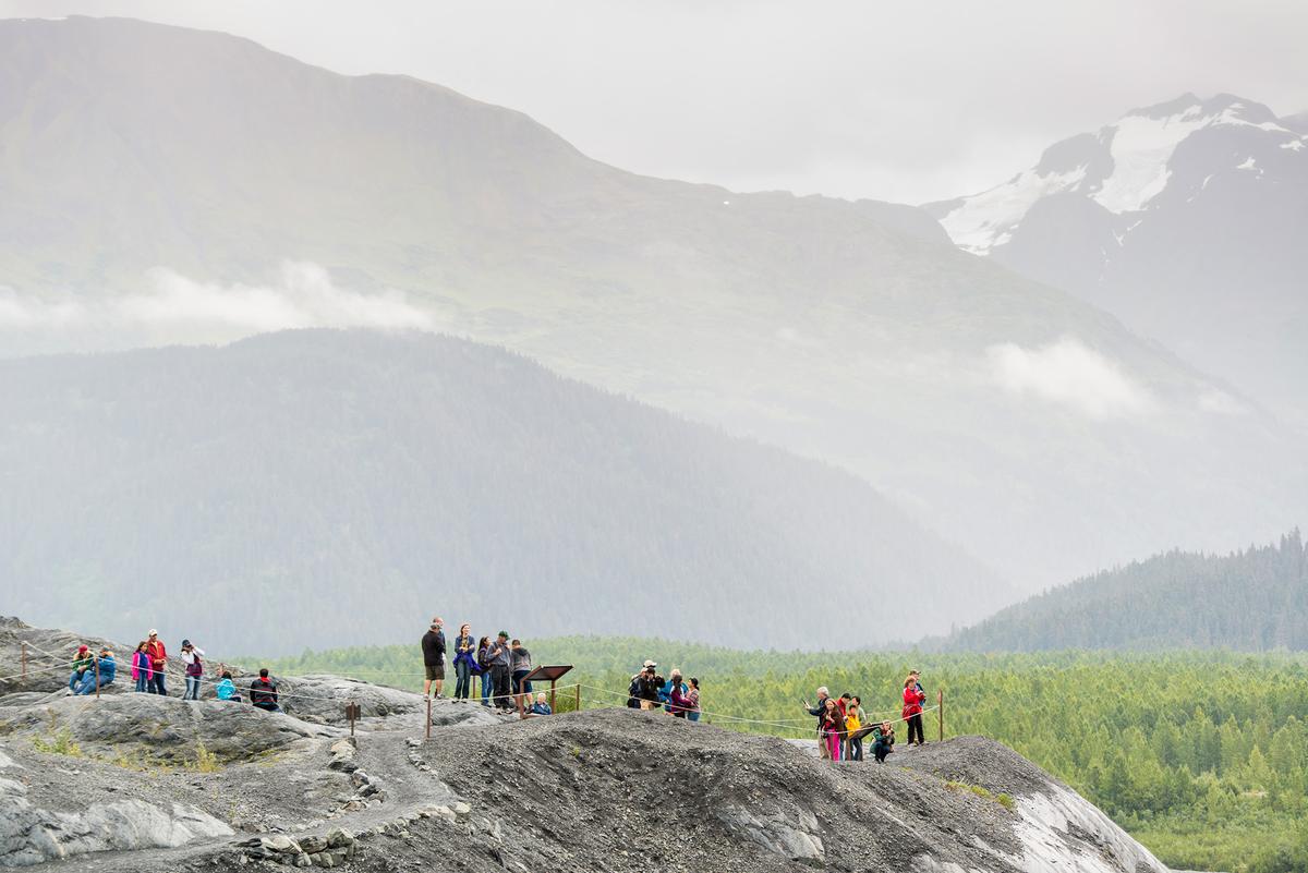 Visitors pause to admire Anchorage’s dramatic surrounding landscape. (Edwin Remsberg/Getty Images)
