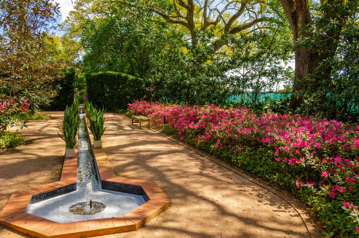 Inspired by a garden at Quinta do Cabo near Lisbon, Portugal, which Edith Stern visited with William Platt in 1964, the Canal Garden offers a shaded, geometrically designed retreat. A narrow water rill flows through its center, bordered by hydrangeas and seasonal blooms that lend vibrancy to the garden's cool, structured symmetry. (Longue Vue House and Gardens)