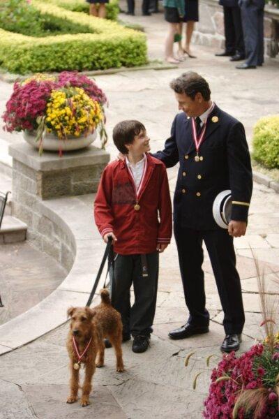 Rexxx with Sean (Josh Hutcherson) and Captain Connor Fahey, in "Firehouse Dog." (20th Century Fox)
