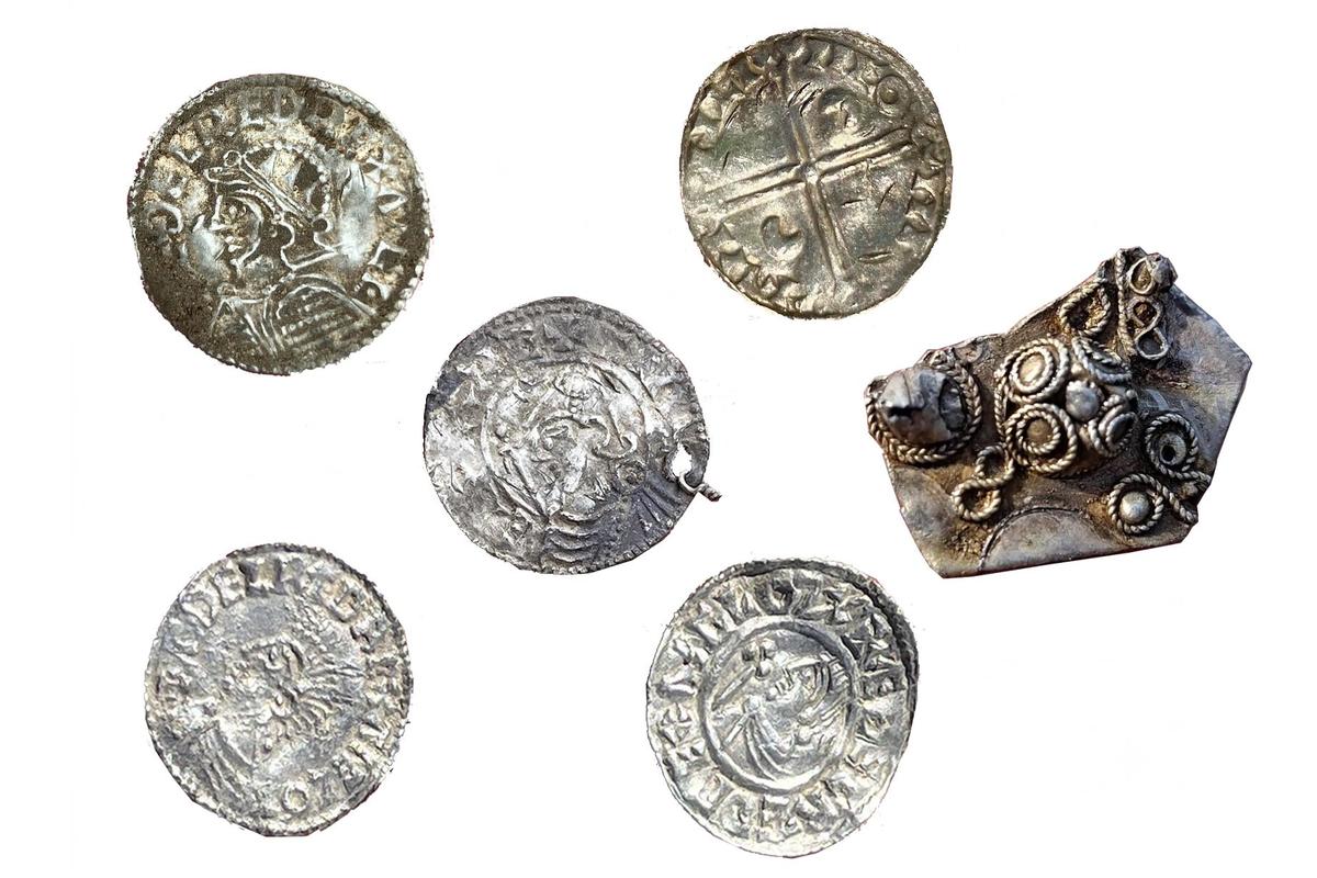 Foreign and domestic silver coins and bullion were found in the Mørstad Hoard, the largest Viking Age hoard recorded in Norwegian history. (Innlandet County Authority)