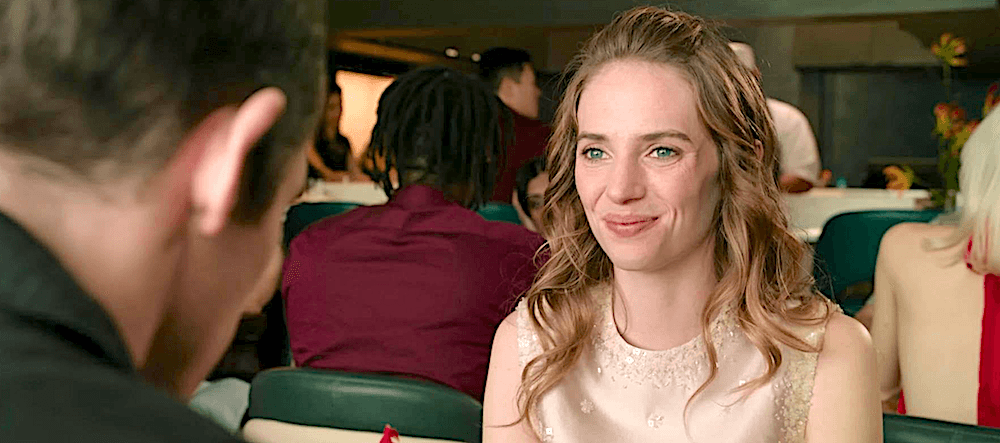 Owen (Callum Turner) being told by girlfriend Malika (Maya Hawke) that she's going to be having sex with whomever she pleases, in "One Night Only." (Universal Pictures)