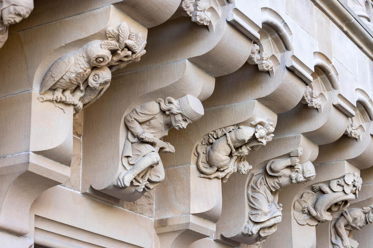 Indicative of a medieval theme at Moszna Castle are ornamental corbels representing real and mythical creatures as well as men often engaged in work. Visible in this photograph are a sculpted owl, rat, and lizard projecting from beneath the bracket. Natural motifs of leaves, pine cones, and flowers are also present. (Jolanta Wojcicka/Shutterstock)