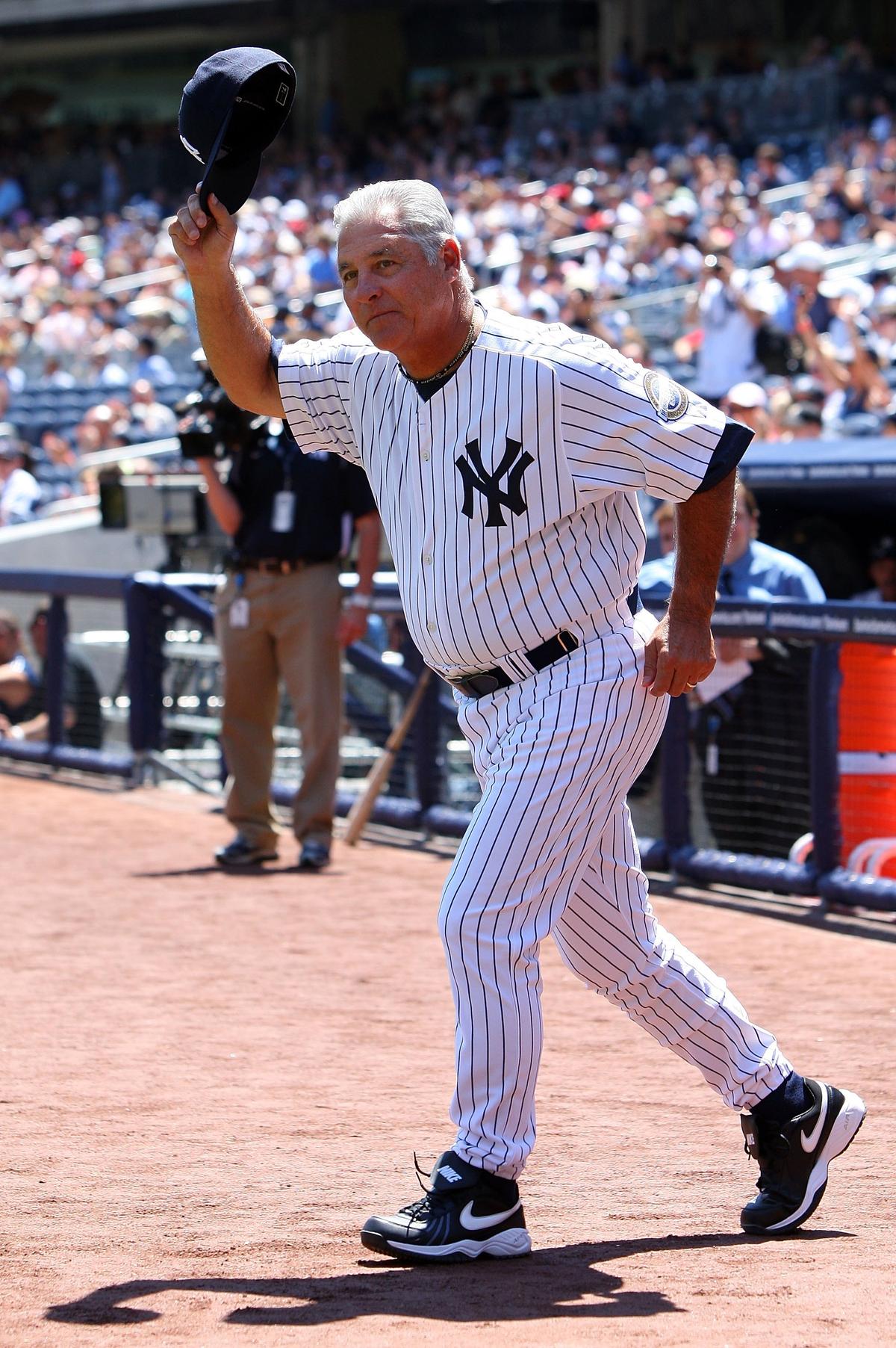 Former New York Yankee Bucky Dent waves to the crowd during the teams 63rd Old Timers Day before the game against the Detroit Tigers at Yankee Stadium in the Bronx borough of New York City on July 19, 2009.  (Jim McIsaac/Getty Images)