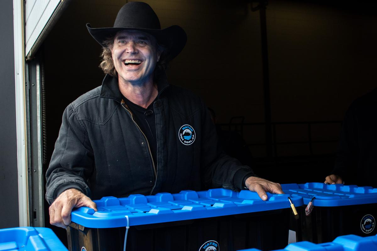 Alberta country music artist and rancher Corb Lund formally submits his "Water Not Coal" anti-coal mining petition to Elections Alberta, in Edmonton, on June 10, 2026. (The Canadian Press/Amanda Erickson)