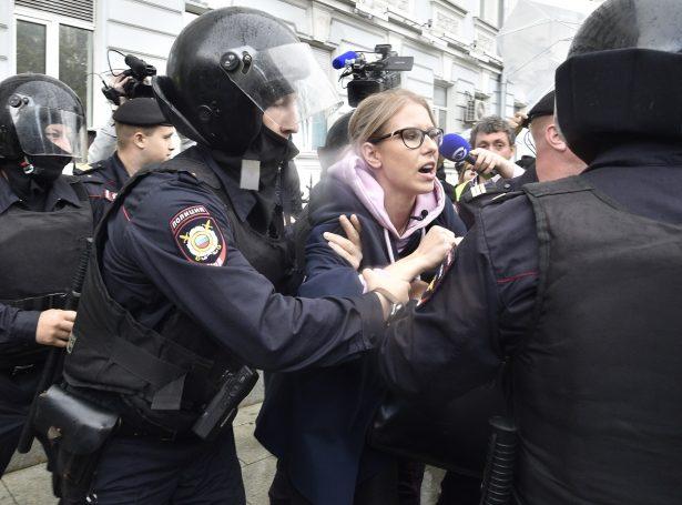 Police officers detain a protestor during an unsanctioned rally in the center of Moscow, Russia, on Aug. 3, 2019. (Pavel Golovkin/AP Photo)