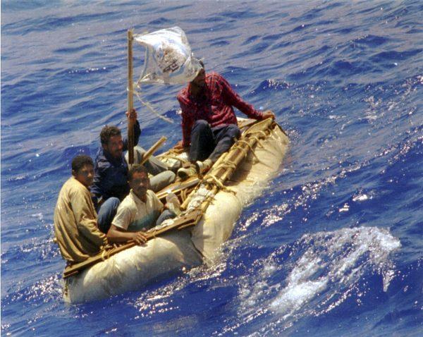 Cuban refugees float in seas, 60 miles south of Key West, Fla. in this Aug. 26, 1994, file photo. (AP Photo/Dave Martin, File)