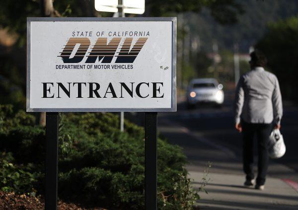A sign is posted in front of a California Department of Motor Vehicles (DMV) office in Corte Madera, Calif., on May 9, 2017. (Photo by Justin Sullivan/Getty Images)