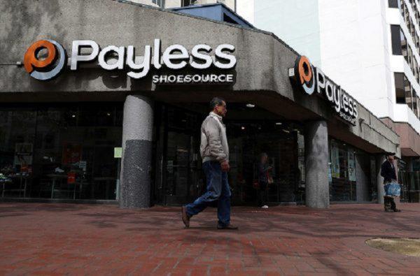 A pedestrian walks by a Payless Shoe Source store in San Francisco, Calif., on April 5, 2017. (Photo by Justin Sullivan/Getty Images)