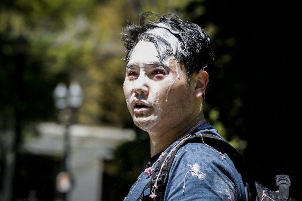 Andy Ngo, a Portland-based journalist, is seen covered in an unknown substance after being attacked by Antifa in Portland, Ore., on June 29, 2019. (Moriah Ratner/Getty Images)