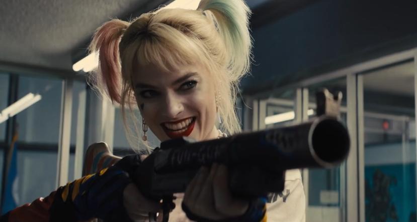 Harley Quinn (Margot Robbie) menaces the police with a beanbag gun in "Birds of Prey." (Warner Bros.)