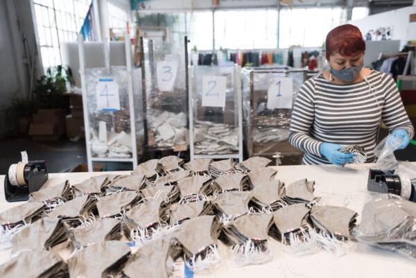 A worker packages masks at the Hedley & Bennett factory in Los Angeles. (Anna Maria Zunino Noellert)