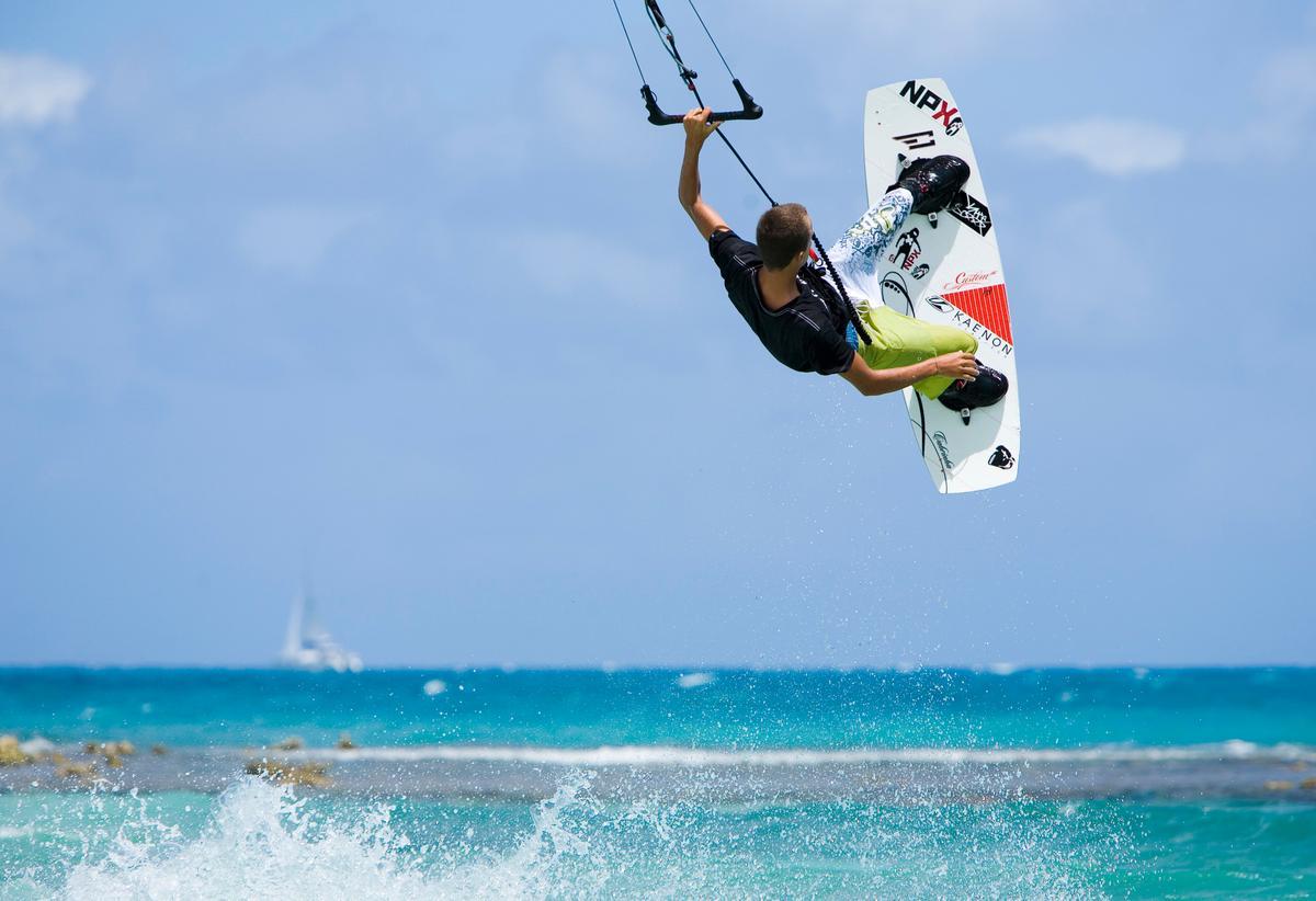 A kitesurfer hits the waves. (Antigua and Barbuda Tourism Authority)
