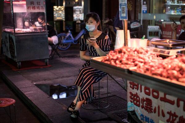 A crawfish vendor sits on Jiqing Street in Wuhan, China on June 5th, 2020. (Getty Images)