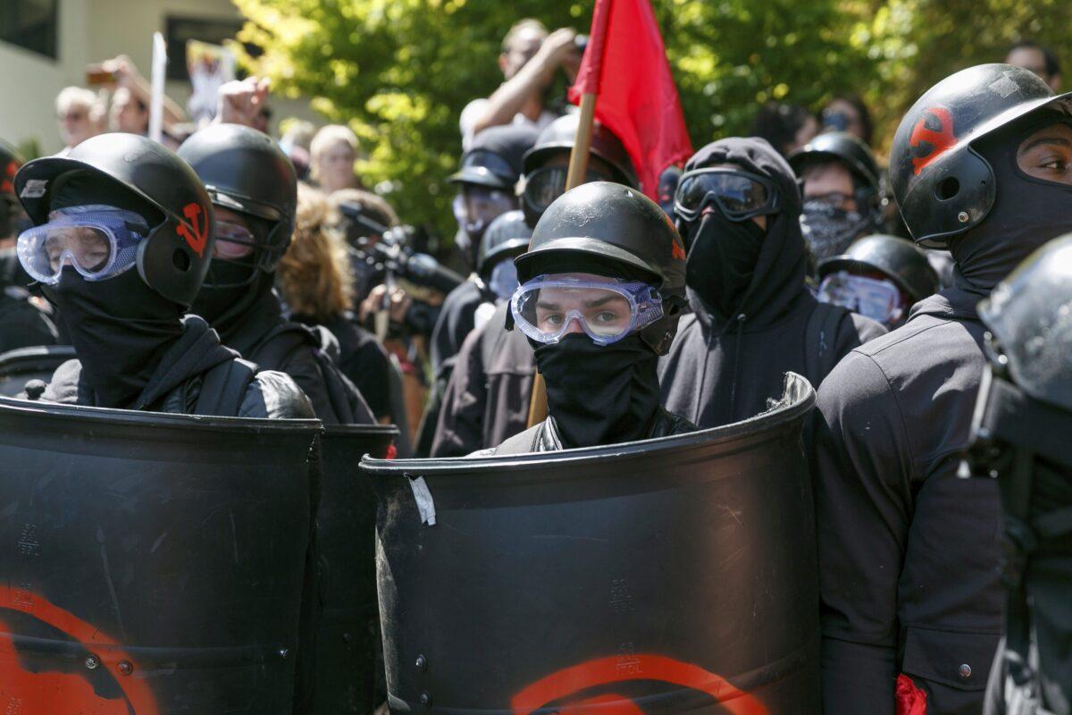 Antifa members prepare to clash with Patriot Prayer protesters during a rally in Portland, Ore., on Aug. 4, 2018. (John Rudoff/AP Photo)