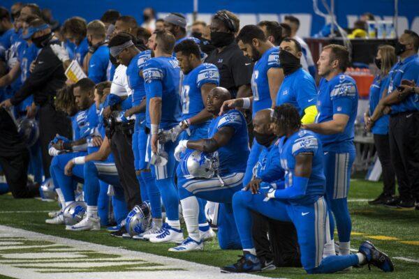 Detroit Lions players kneel during the national anthem before the first quarter against the Chicago Bears at Ford Field in Detroit, Michigan, on Sept. 13, 2020. (Nic Antaya/Getty Images)
