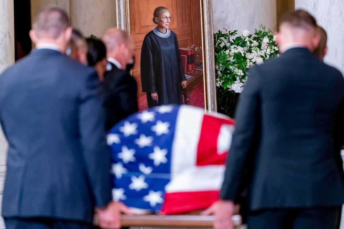 The flag-draped casket of Justice Ruth Bader Ginsburg, carried by Supreme Court police officers, arrives in the Great Hall at the Supreme Court in Washington, on Sept. 23, 2020. (Andrew Harnik, Pool/AP Photo)