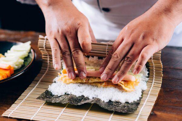 Tuck the fillings in tightly when you roll up your kimbap. (Tung Le/Shutterstock)