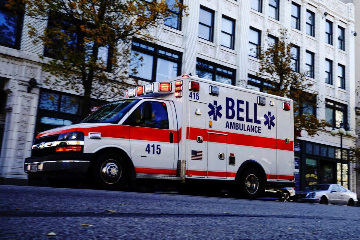 An ambulance speeds through the Bronzeville neighborhood on the North Side of Milwaukee, amid the COVID-19 pandemic, on Nov. 6, 2020. (Bing Guan/Reuters)