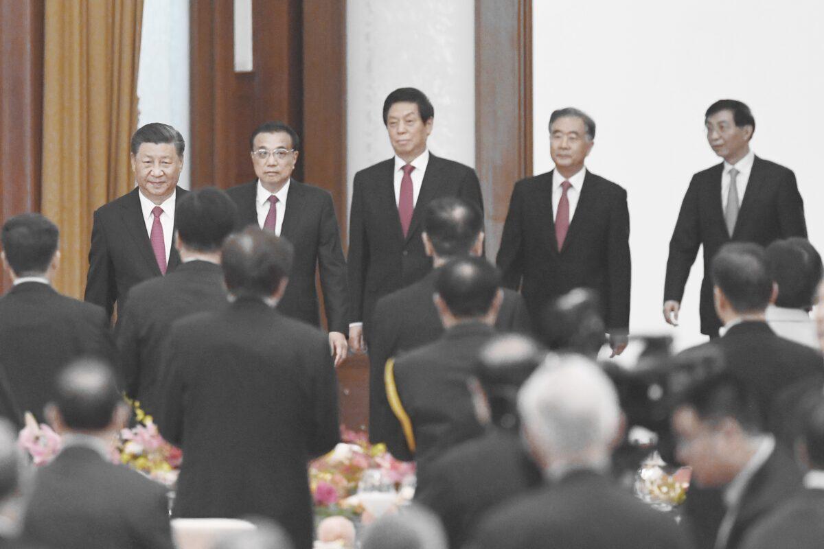 Chinese leader Xi Jinping (L), Premier Li Keqiang (2nd L), and Politburo Standing Committee members (L-R) Li Zhanshu, Wang Yang, and Wang Huning arrive for a reception at the Great Hall of the People in Beijing, China on Sept. 30, 2020. (Greg Baker/AFP via Getty Images)