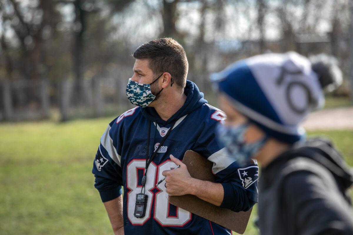 A teacher and a student wear masks during an exercise period at a school in Stamford, Conn., on Nov. 24, 2020. (John Moore/Getty Images)
